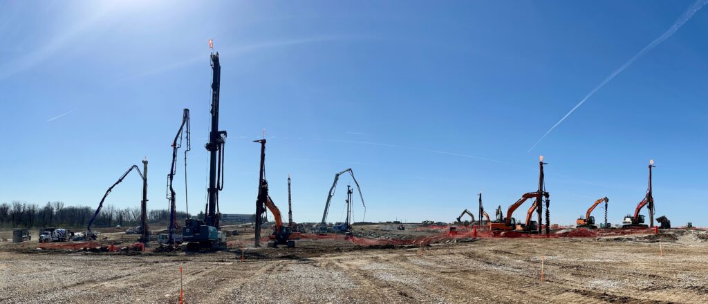 panoramic of rigs installing rigid inclusions into the soil